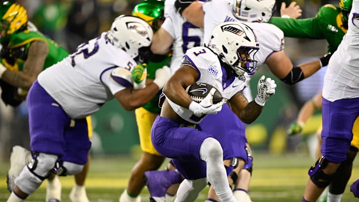 Dec 20, 2025; Eugene, OR, USA;  James Madison Dukes running back Wayne Knight (3) rushes during the second quarter against the Oregon Ducks at Autzen Stadium. Mandatory Credit: Troy Wayrynen-Imagn Images
