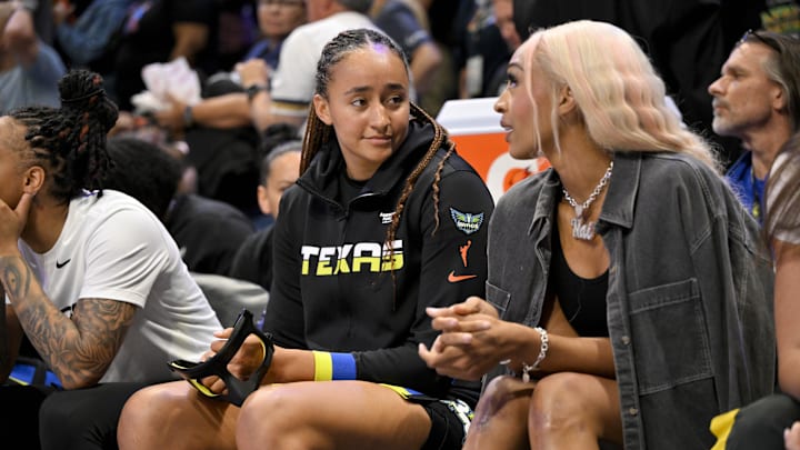 Jun 28, 2025; Arlington, Texas, USA; Dallas Wings guard Haley Jones (left) talks with guard DiJonai Carrington (right) on the bench during the second half against the Washington Mystics at College Park Center. Mandatory Credit: Jerome Miron-Imagn Images Jun 28, 2025; Arlington, Texas, USA; Dallas Wings guard Haley Jones (left) talks with guard DiJonai Carrington (right) on the bench during the second half against the Washington Mystics at College Park Center. Mandatory Credit: Jerome Miron-Imagn Images