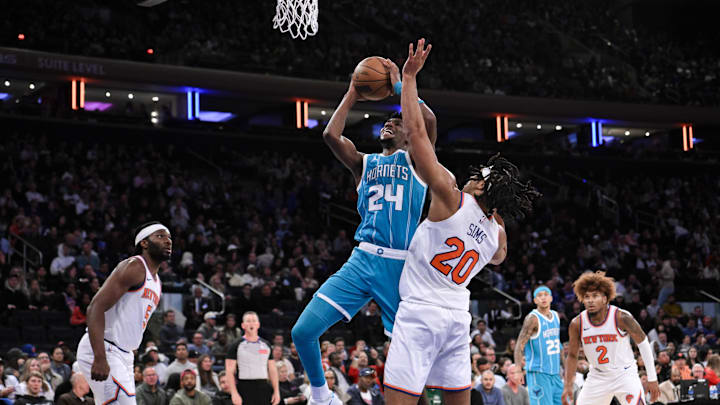 Oct 15, 2024; New York, New York, USA; Charlotte Hornets forward Brandon Miller (24) shoots the ball while being defended by New York Knicks center Jericho Sims (20) during the second half at Madison Square Garden. Mandatory Credit: John Jones-Imagn Images Oct 15, 2024; New York, New York, USA; Charlotte Hornets forward Brandon Miller (24) shoots the ball while being defended by New York Knicks center Jericho Sims (20) during the second half at Madison Square Garden. Mandatory Credit: John Jones-Imagn Images