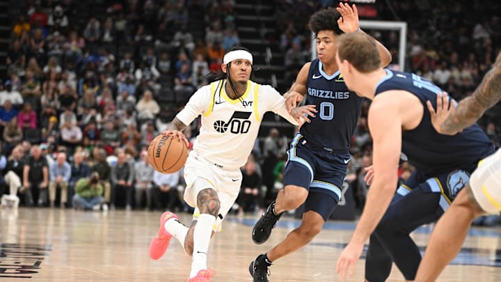 Utah Jazz point guard Jordan Clarkson drives in defender Memphis Grizzlies forward Jalen Wells. Mandatory Credit: Matthew Smith-Imagn Images