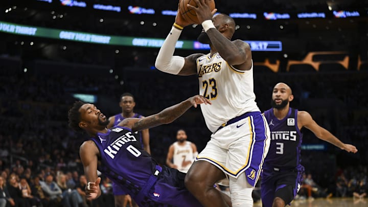 Oct 26, 2024; Los Angeles, California, USA; Los Angeles Lakers forward LeBron James (23) knocks down Sacramento Kings guard Malik Monk (0) during the second half at Crypto.com Arena. Mandatory Credit: Jonathan Hui-Imagn Images Oct 26, 2024; Los Angeles, California, USA; Los Angeles Lakers forward LeBron James (23) knocks down Sacramento Kings guard Malik Monk (0) during the second half at Crypto.com Arena. Mandatory Credit: Jonathan Hui-Imagn Images