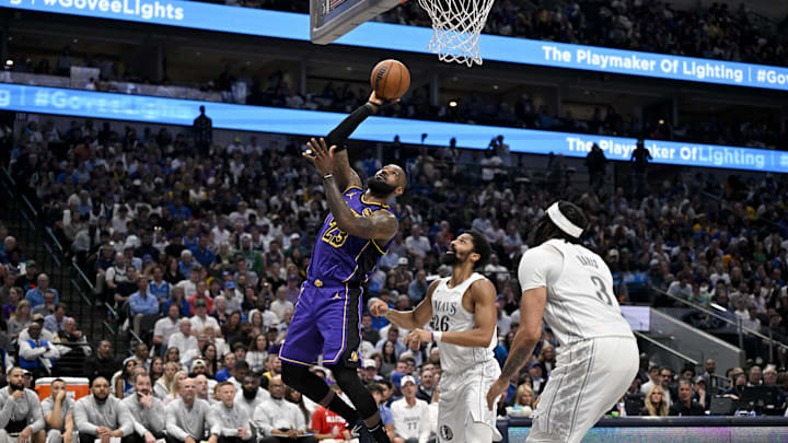 Apr 9, 2025; Dallas, Texas, USA; Los Angeles Lakers forward LeBron James (23) shoots the ball past Dallas Mavericks guard Spencer Dinwiddie (26) during the third quarter at the American Airlines Center. Mandatory Credit: Jerome Miron-Imagn Images
