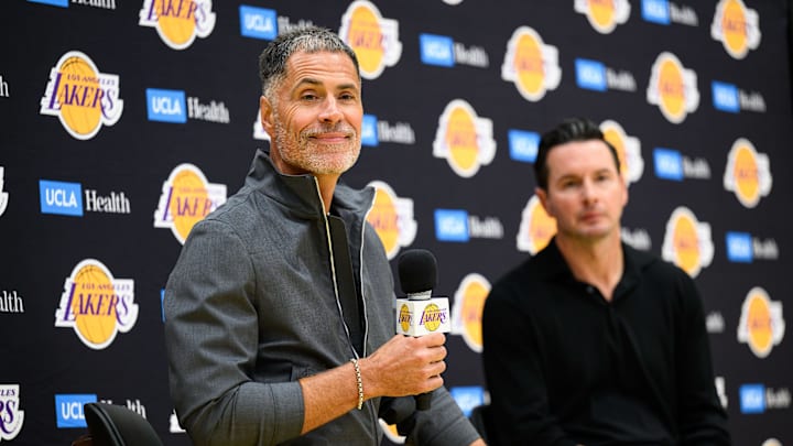 Sep 25, 2025; El Segundo, CA, USA; Los Angeles Lakers general manager Rob Pelinka, left, speaks during a press conference to preview the 2025-26 season at UCLA Health Training Center. Mandatory Credit: William Liang-Imagn Images