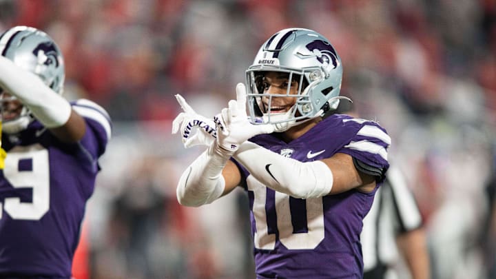 Dec 28, 2023; Orlando, FL, USA; Kansas State cornerback Jacob Parrish (10) celebrates an interception against NC State in the fourth quarter at Camping World Stadium. Mandatory Credit: Jeremy Reper-Imagn Images Dec 28, 2023; Orlando, FL, USA; Kansas State cornerback Jacob Parrish (10) celebrates an interception against NC State in the fourth quarter at Camping World Stadium. Mandatory Credit: Jeremy Reper-Imagn Images