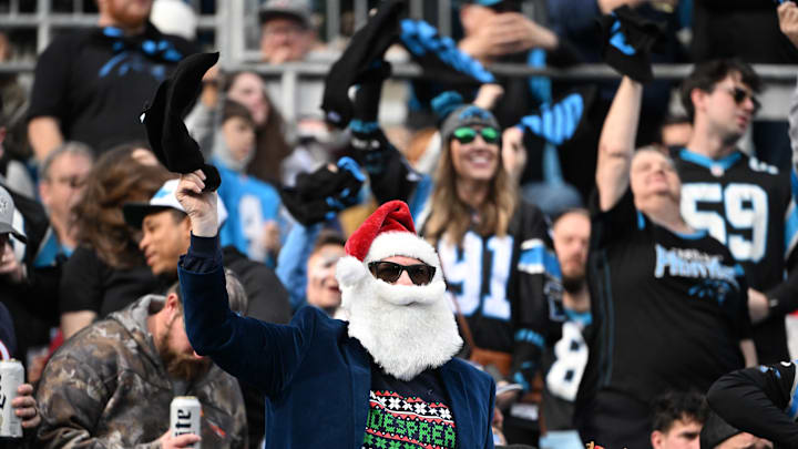 Dec 21, 2025; Charlotte, North Carolina, USA; Carolina Panthers fans cheer in the second quarter at Bank of America Stadium. Mandatory Credit: Bob Donnan-Imagn Images