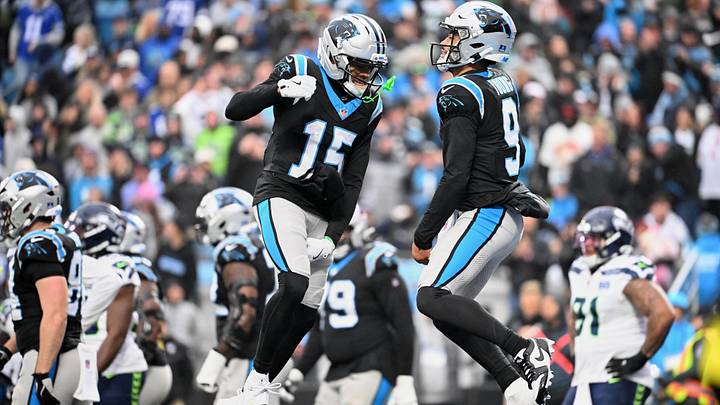 Carolina Panthers quarterback Bryce Young (9) leaps and celebrates with wide receiver Jimmy Horn Jr. (15) after scoring a touchdown 