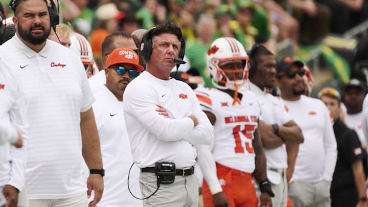 Sep 6, 2025; Eugene, Oregon, USA; Oklahoma State Cowboys head coach Mike Gundy looks up from the sidelines during the first half in a game against the Oregon Ducks at Autzen Stadium. Mandatory Credit: Troy Wayrynen-Imagn Images