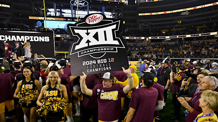 Dec 7, 2024; Arlington, TX, USA; The Arizona State Sun Devils celebrate after the Sun Devils defeat the Iowa State Cyclones at AT&T Stadium. Mandatory Credit: Jerome Miron-Imagn Images Dec 7, 2024; Arlington, TX, USA; The Arizona State Sun Devils celebrate after the Sun Devils defeat the Iowa State Cyclones at AT&T Stadium. Mandatory Credit: Jerome Miron-Imagn Images