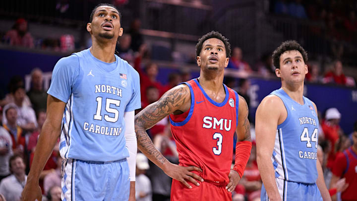 Jan 3, 2026; Dallas, Texas, USA; North Carolina Tar Heels forward Jarin Stevenson (15) and guard Luka Bogavac (44) and SMU Mustangs forward Corey Washington (3) look on during the game between the Mustangs and the Tar Heels at Moody Coliseum. Mandatory Credit: Jerome Miron-Imagn Images