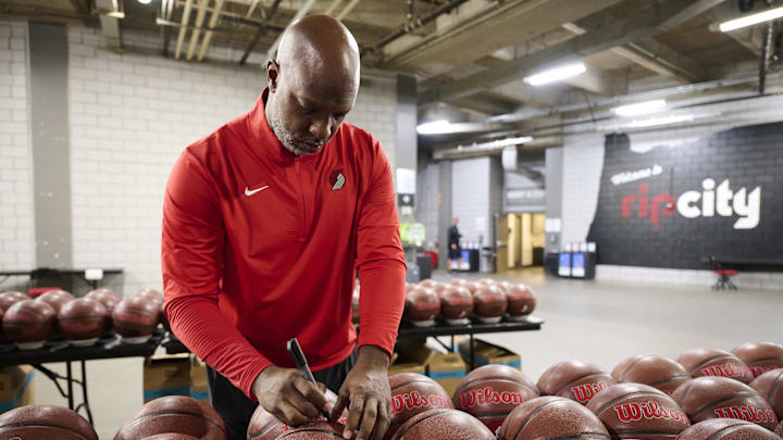 Sep 29, 2025; Portland, OR, USA; Portland Trail Blazers head coach Chauncey Billups signs basketballs during media day at the Moda Center. Mandatory Credit: Troy Wayrynen-Imagn Images Sep 29, 2025; Portland, OR, USA; Portland Trail Blazers head coach Chauncey Billups signs basketballs during media day at the Moda Center. Mandatory Credit: Troy Wayrynen-Imagn Images
