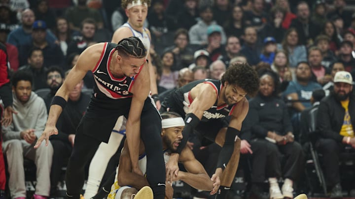 Apr 11, 2025; Portland, Oregon, USA; Golden State Warriors guard Moses Moody (4) gets tied up during the first half against Portland Trail Blazers forward Toumani Camara (33), left, and guard Matisse Thybulle (4) at Moda Center. Mandatory Credit: Troy Wayrynen-Imagn Images Apr 11, 2025; Portland, Oregon, USA; Golden State Warriors guard Moses Moody (4) gets tied up during the first half against Portland Trail Blazers forward Toumani Camara (33), left, and guard Matisse Thybulle (4) at Moda Center. Mandatory Credit: Troy Wayrynen-Imagn Images
