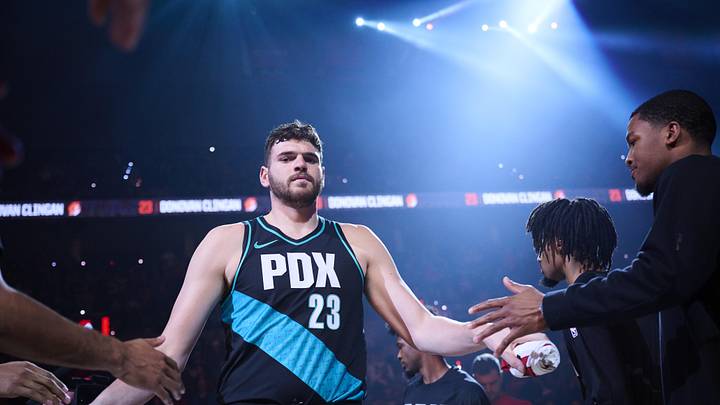 Portland Trail Blazers center Donovan Clingan high fives teammates during introductions before a game against the Sacramento Kings at Moda Center. Mandatory Credit: Troy Wayrynen-Imagn Images