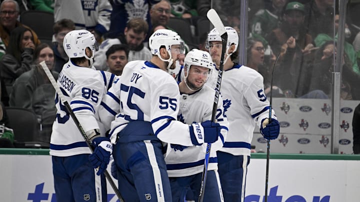 Dec 21, 2025; Dallas, Texas, USA; Toronto Maple Leafs defenseman Oliver Ekman-Larsson (95) and center Nicolas Roy (55) and center Scott Laughton (24) and defenseman Philippe Myers (51) celebrates a goal scored by Laughton against the Dallas Stars during the third period at the American Airlines Center. Mandatory Credit: Jerome Miron-Imagn Images Dec 21, 2025; Dallas, Texas, USA; Toronto Maple Leafs defenseman Oliver Ekman-Larsson (95) and center Nicolas Roy (55) and center Scott Laughton (24) and defenseman Philippe Myers (51) celebrates a goal scored by Laughton against the Dallas Stars during the third period at the American Airlines Center. Mandatory Credit: Jerome Miron-Imagn Images