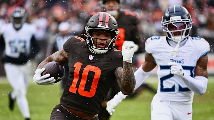 Dec 7, 2025; Cleveland, Ohio, USA; Cleveland Browns running back Quinshon Judkins (10) runs with the ball against Tennessee Titans safety Kevin Winston Jr. (23) during the first quarter at Huntington Bank Field. Mandatory Credit: Ken Blaze-Imagn Images