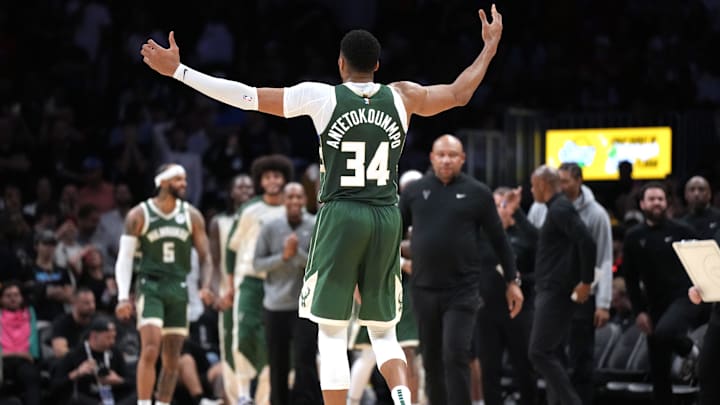 Apr 5, 2025; Miami, Florida, USA;  Milwaukee Bucks forward Giannis Antetokounmpo (34) celebrates extending the lead against the Miami Heat in overtime at Kaseya Center. Mandatory Credit: Jim Rassol-Imagn Images