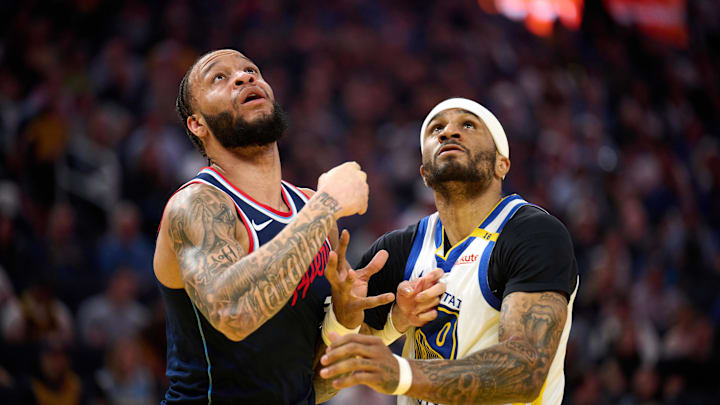 Apr 13, 2025; San Francisco, California, USA; LA Clippers guard Amir Coffey (7) and Golden State Warriors guard Gary Payton II (0) vie for position during the first quarter at Chase Center. Mandatory Credit: Robert Edwards-Imagn Images