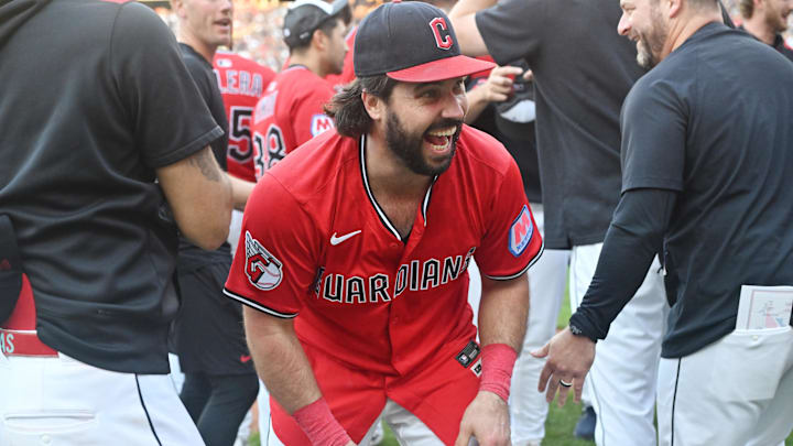 Sep 28, 2025; Cleveland, Ohio, USA;  Cleveland Guardians catcher Austin Hedges (27) celebrates after the Guardians beat the Texas Rangers and won the American League Central Division at Progressive Field. Mandatory Credit: Ken Blaze-Imagn Images