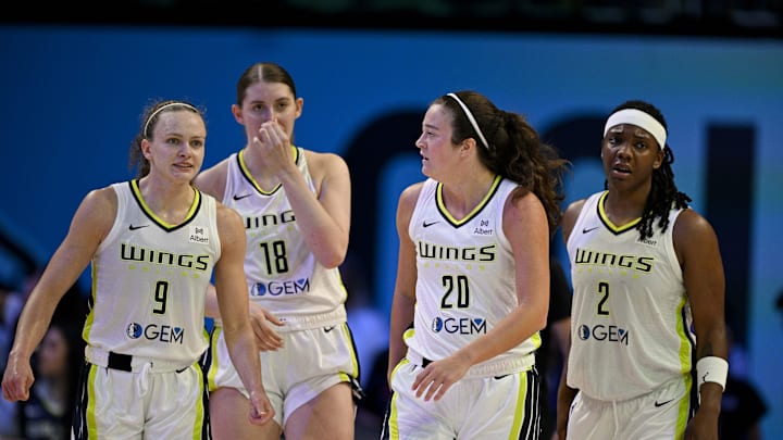 Aug 8, 2025; Arlington, Texas, USA; Dallas Wings guard Grace Berger (9) and center Luisa Geiselsoder (18) and forward Maddy Siegrist (20) and forward Myisha Hines-Allen (2) during the game between the Dallas Wings and the New York Liberty at College Park Center. Mandatory Credit: Jerome Miron-Imagn Images Aug 8, 2025; Arlington, Texas, USA; Dallas Wings guard Grace Berger (9) and center Luisa Geiselsoder (18) and forward Maddy Siegrist (20) and forward Myisha Hines-Allen (2) during the game between the Dallas Wings and the New York Liberty at College Park Center. Mandatory Credit: Jerome Miron-Imagn Images