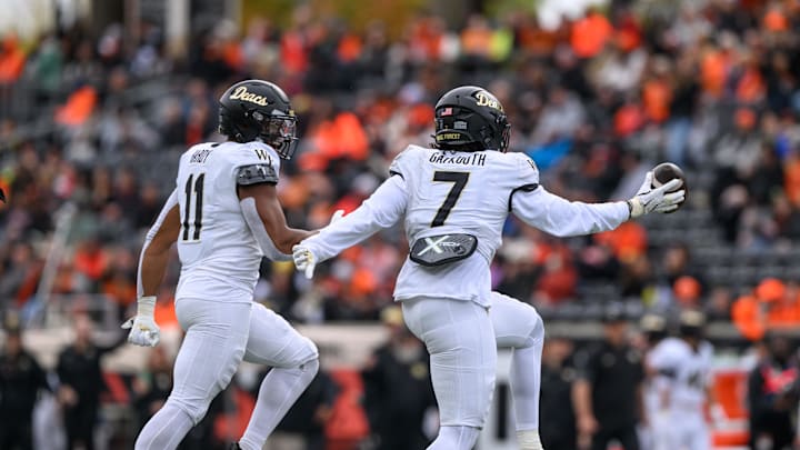 Oct 11, 2025; Corvallis, Oregon, USA; Wake Forest Demon Deacons defensive lineman Nuer Gatkuoth (7) celebrates an interception against the Oregon State Beavers during the second quarter at Reser Stadium. Mandatory Credit: Craig Strobeck-Imagn Images Oct 11, 2025; Corvallis, Oregon, USA; Wake Forest Demon Deacons defensive lineman Nuer Gatkuoth (7) celebrates an interception against the Oregon State Beavers during the second quarter at Reser Stadium. Mandatory Credit: Craig Strobeck-Imagn Images