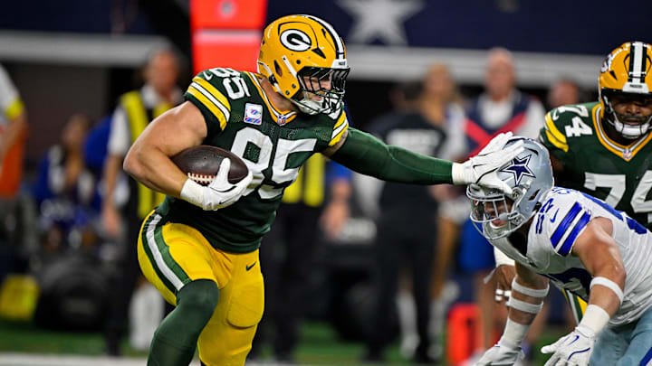 Green Bay Packers tight end Tucker Kraft (85) stiff arms Dallas Cowboys linebacker Jack Sanborn (57) during the game between the Dallas Cowboys and the Green Bay Packers at AT&T Stadium. Green Bay Packers tight end Tucker Kraft (85) stiff arms Dallas Cowboys linebacker Jack Sanborn (57) during the game between the Dallas Cowboys and the Green Bay Packers at AT&T Stadium.