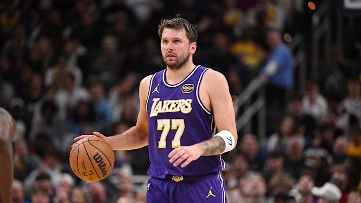 Mar 25, 2026; Indianapolis, Indiana, USA;  Los Angeles Lakers guard Luka Doncic (77) dribbles the ball down court during the second half against the Indiana Pacers at Gainbridge Fieldhouse. 