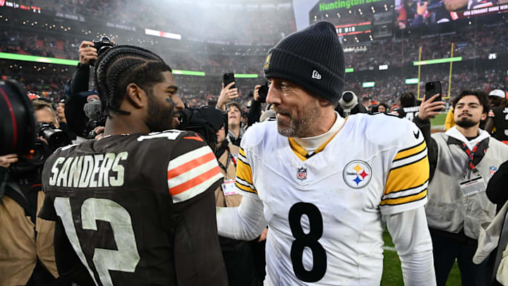 Dec 28, 2025; Cleveland, Ohio, USA; Pittsburgh Steelers quarterback Aaron Rodgers (8) and Cleveland Browns quarterback Shedeur Sanders (12) hug after the game at Huntington Bank Field. Mandatory Credit: Ken Blaze-Imagn Images