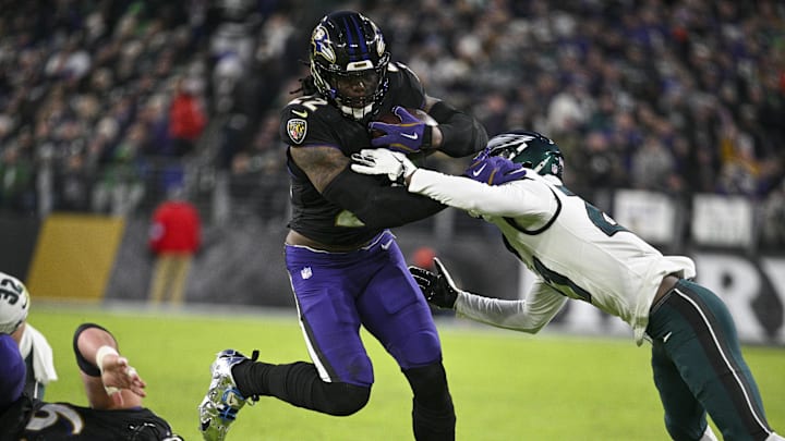 Dec 1, 2024; Baltimore, Maryland, USA; Baltimore Ravens running back Derrick Henry (22) rushes through Philadelphia Eagles cornerback Eli Ricks (23) tackle attempt during the first half at M&T Bank Stadium. Dec 1, 2024; Baltimore, Maryland, USA; Baltimore Ravens running back Derrick Henry (22) rushes through Philadelphia Eagles cornerback Eli Ricks (23) tackle attempt during the first half at M&T Bank Stadium.