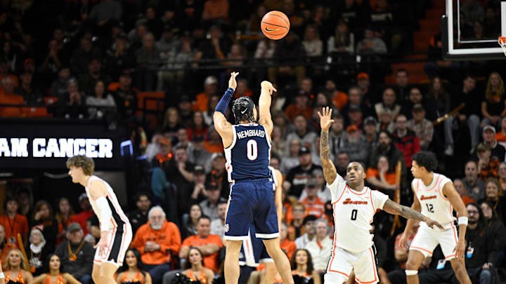 Gonzaga Bulldogs guard Ryan Nembhard (0) shoots a thee point shot over Oregon State Beavers guard Damarco Minor.