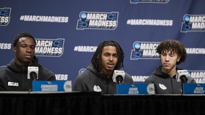 Mar 18, 2026; Portland, OR, USA; Gonzaga Bulldogs forward Emmanuel Innocenti (5), left, guard Adam Miller (23), and guard Jalen Warley (8) answer questions during a press conference before a practice session ahead of the first round of the men's 2026 NCAA Tournament at Moda Center. Mar 18, 2026; Portland, OR, USA; Gonzaga Bulldogs forward Emmanuel Innocenti (5), left, guard Adam Miller (23), and guard Jalen Warley (8) answer questions during a press conference before a practice session ahead of the first round of the men's 2026 NCAA Tournament at Moda Center.
