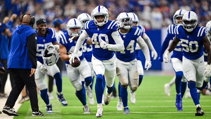 Sep 22, 2024; Indianapolis, Indiana, USA; Indianapolis Colts cornerback Jaylon Jones (40) and his teammates run to the end zone celebrate an interception during the second half against the Chicago Bears at Lucas Oil Stadium.