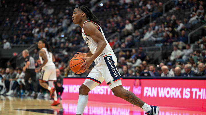 Oct 28, 2025; Hartford, CT, USA; Connecticut Huskies guard Silas Demary Jr. (2) dribbles the ball during the second half against the Michigan State Spartans at PeoplesBank Arena. Mandatory Credit: Mark Smith-Imagn Images