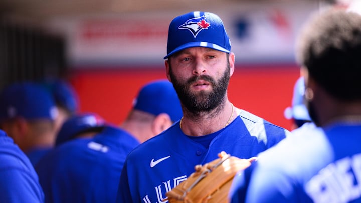 Toronto Blue Jays pitcher Tommy Nance is greeted by teammates after a pitching change.
