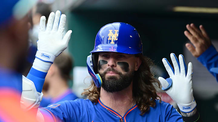 May 4, 2025; St. Louis, Missouri, USA; New York Mets outfielder Jesse Winker (3) is congratulated in the dugout after hitting a sacrifice fly to left, scoring teammate Juan Soto (not shown) against the St. Louis Cardinals at Busch Stadium. Mandatory Credit: Tim Vizer-Imagn Images