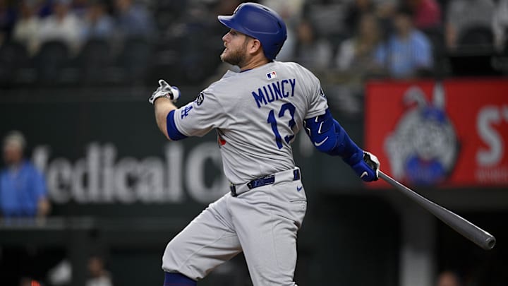 Apr 20, 2025; Arlington, Texas, USA; Los Angeles Dodgers third baseman Max Muncy (13) bats against the Texas Rangers during the ninth inning at Globe Life Field. Mandatory Credit: Jerome Miron-Imagn Images