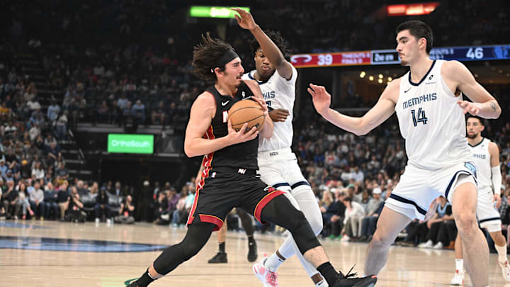 Mar 15, 2025; Memphis, Tennessee, USA; Miami Heat guard Jaime Jaquez Jr. (11) drives into defender Memphis Grizzlies forward GG Jackson (45) in the second quarter of the game against the Memphis Grizzlies at FedExForum. Mandatory Credit: Matthew Smith-Imagn Images Mar 15, 2025; Memphis, Tennessee, USA; Miami Heat guard Jaime Jaquez Jr. (11) drives into defender Memphis Grizzlies forward GG Jackson (45) in the second quarter of the game against the Memphis Grizzlies at FedExForum. Mandatory Credit: Matthew Smith-Imagn Images