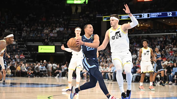 Mar 12, 2025; Memphis, Tennessee, USA; Memphis Grizzlies shooting guard Desmond Bane (22) drives into Utah Jazz center Walker Kessler (24) during the game at FedExForum. Mandatory Credit: Matthew Smith-Imagn Images