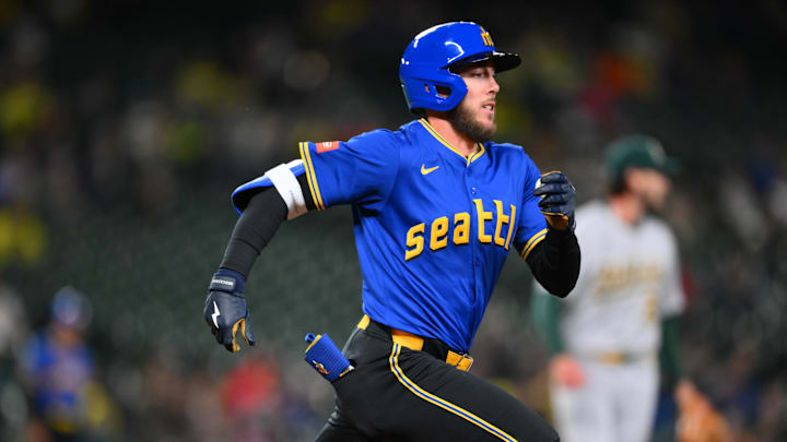 Seattle Mariners pinch hitter Miles Mastrobuoni (21) runs towards first base after hitting a single against the Athletics during the ninth inning at T-Mobile Park on March 28.
