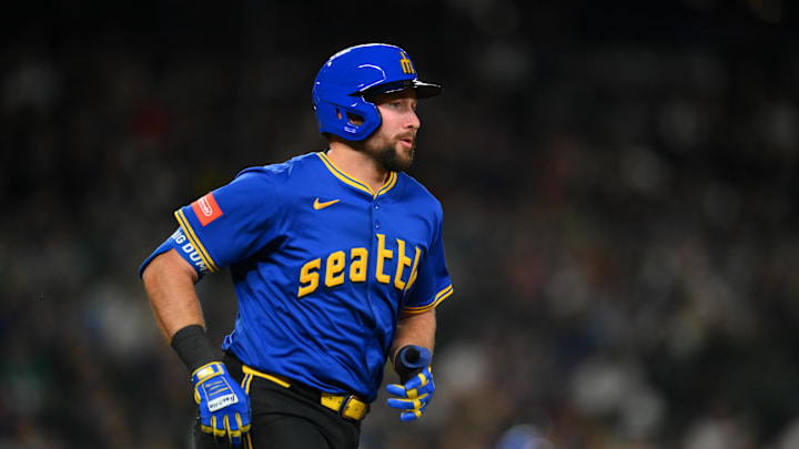 Seattle Mariners catcher Cal Raleigh (29) runs towards first base after hitting a single against the Miami Marlins during the eighth inning at T-Mobile Park on April 25.