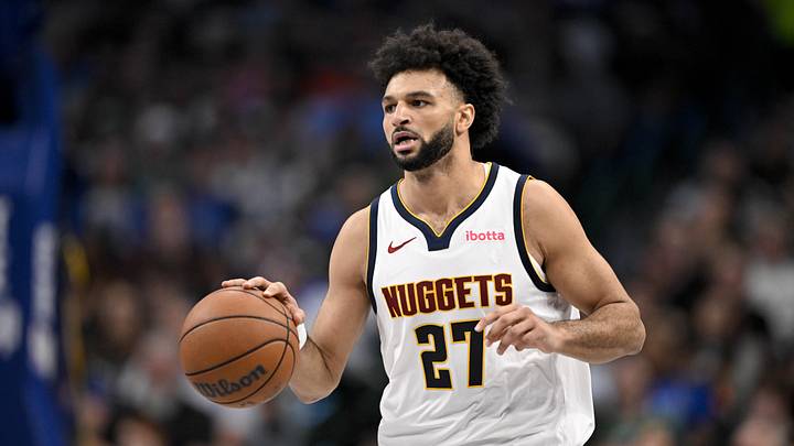 Dec 23, 2025; Dallas, Texas, USA; Denver Nuggets guard Jamal Murray (27) brings the ball up court during the game between the Mavericks and the Nuggets at the American Airlines Center.