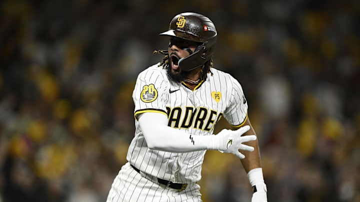 Oct 8, 2024; San Diego, California, USA; San Diego Padres outfielder Fernando Tatis Jr. (23) reacts after hitting a home run in the second inning against the Los Angeles Dodgers during game three of the NLDS for the 2024 MLB Playoffs at Petco Park.  Mandatory Credit: Denis Poroy-Imagn Images
