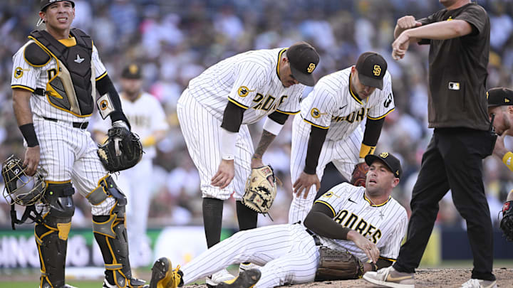 Sep 1, 2025; San Diego, California, USA; San Diego Padres relief pitcher Jason Adam (40) lies on the ground during the seventh inning against the Baltimore Orioles at Petco Park. Adam was taken away in a cart after the play. Mandatory Credit: Denis Poroy-Imagn Images