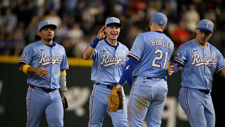 First baseman Jake Burger and his teammates celebrate.