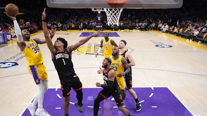 Apr 18, 2026; Los Angeles, California, USA; Los Angeles Lakers guard Marcus Smart (36) shoots the ball against Houston Rockets guard Amen Thompson (1) in the second half during game one of the first round of the 2026 NBA Playoffs at Crypto.com Arena. Mandatory Credit: Kirby Lee-Imagn Images