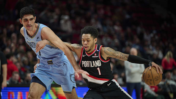 Portland Trail Blazers guard Anfernee Simons drives to the basket during the second half against Memphis Grizzlies forward Santi Aldama. Mandatory Credit: Troy Wayrynen-Imagn Images