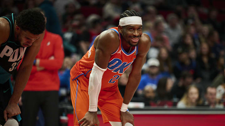 Nov 30, 2025; Portland, Oregon, USA; Oklahoma City Thunder guard Shai Gilgeous-Alexander (2) smiles at a fan during the second half in a game against the Portland Trail Blazers at Moda Center. Mandatory Credit: Troy Wayrynen-Imagn Images