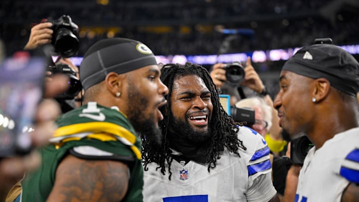 Sep 28, 2025; Arlington, Texas, USA; Green Bay Packers defensive end Micah Parsons (1) talks with his former teammates after the game between the Dallas Cowboys and the Green Bay Packers at AT&T Stadium. Mandatory Credit: Jerome Miron-Imagn Images