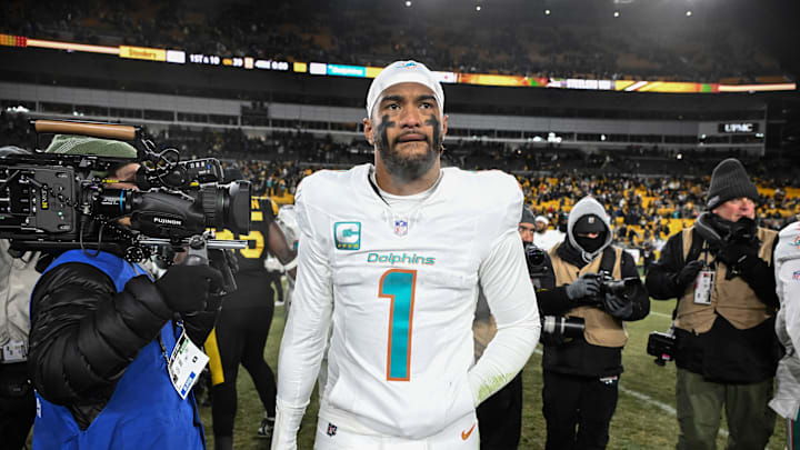 Dec 15, 2025; Pittsburgh, Pennsylvania, USA; Miami Dolphins quarterback Tua Tagovailoa (1) leaves the  field following a game against the Pittsburgh Steelers at Acrisure Stadium. Mandatory Credit: Barry Reeger-Imagn Images