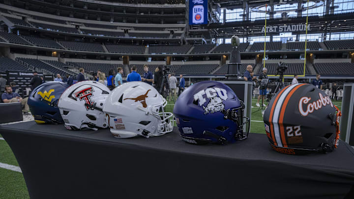 Jul 13, 2022; Arlington, TX, USA; A view of the helmets of the West Virginia Mountaineers and the Texas Tech Red Raiders and the Texas Longhorns and the TCU Horned Frogs and the Oklahoma State Cowboys during the Big 12 Media Day at AT&T Stadium. Mandatory Credit: Jerome Miron-Imagn Images Jul 13, 2022; Arlington, TX, USA; A view of the helmets of the West Virginia Mountaineers and the Texas Tech Red Raiders and the Texas Longhorns and the TCU Horned Frogs and the Oklahoma State Cowboys during the Big 12 Media Day at AT&T Stadium. Mandatory Credit: Jerome Miron-Imagn Images