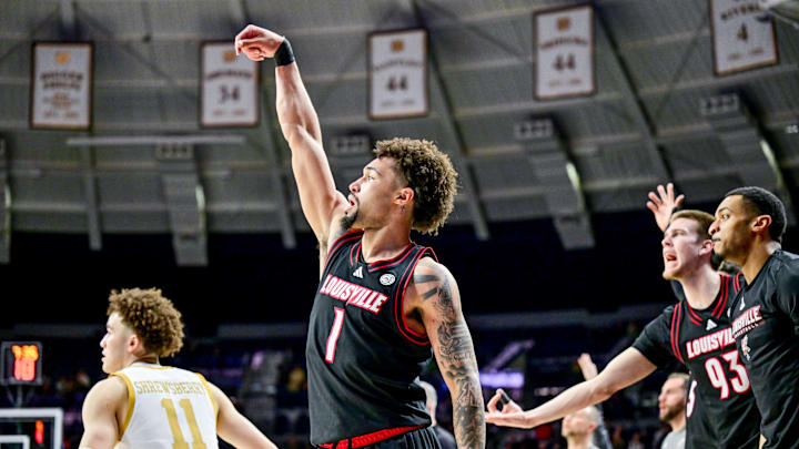 Feb 16, 2025; South Bend, Indiana, USA; Louisville Cardinals guard J'Vonne Hadley (1) watches his shot after shooting a three point basket in the second half against the Notre Dame Fighting Irish at the Purcell Pavilion. Louisville won 75-60. Mandatory Credit: Matt Cashore-Imagn Images