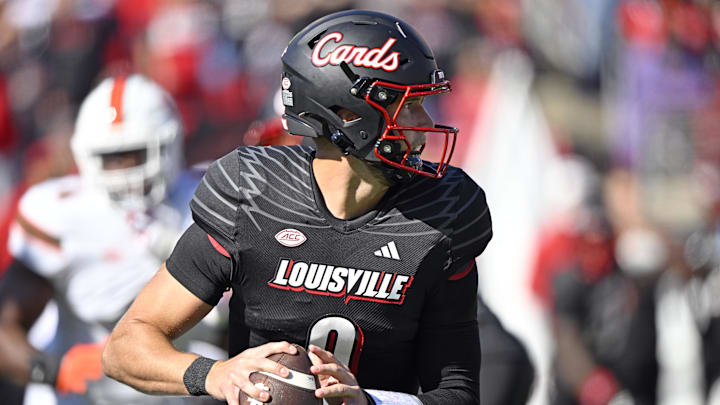 Oct 19, 2024; Louisville, Kentucky, USA; Louisville Cardinals quarterback Tyler Shough (9) looks to pass against the Miami Hurricanes during the first quarter at L&N Federal Credit Union Stadium. Mandatory Credit: Jamie Rhodes-Imagn Images